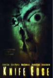 LA MAISON DU DIABLE : Tourné l'an dernier mais distribué seulement ces jours-ci, "Knife Edge" est le nouveau thriller d'horreur de l'Anglais Anthony Hickox (suite ci-dessous)